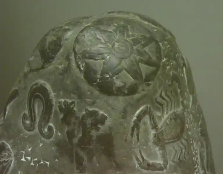 Horns, double-headed lion, scorpion, solar disc on a boundary stone